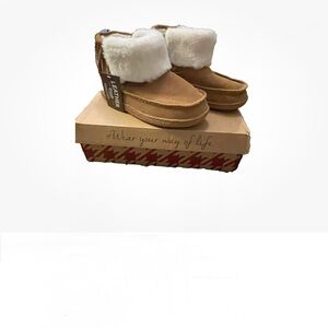 Cozy Tan and White Shearling Boots with fringe.